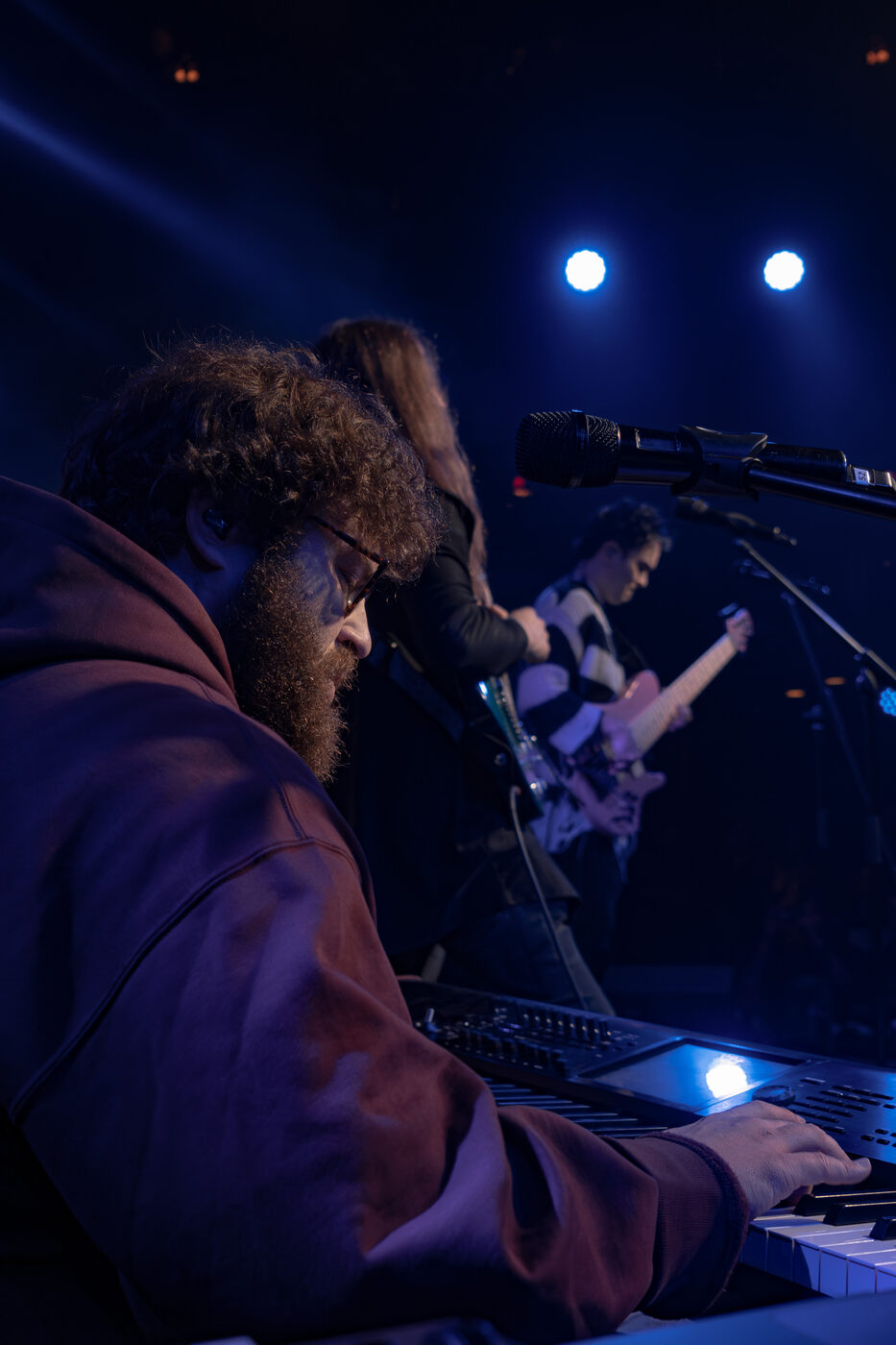 Rob Araujo at the keys under stage lights