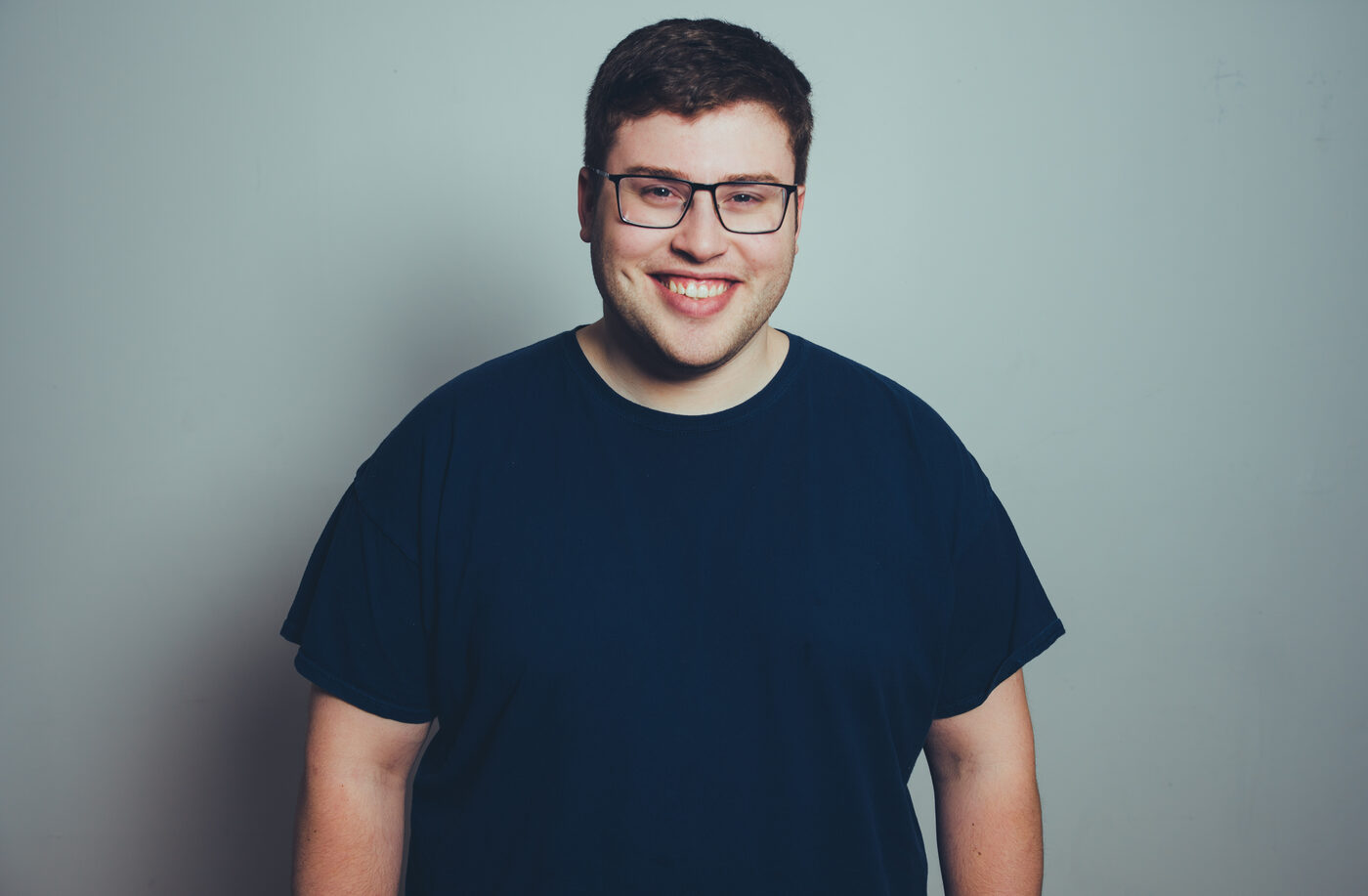 Studio portrait of Rob Araujo standing